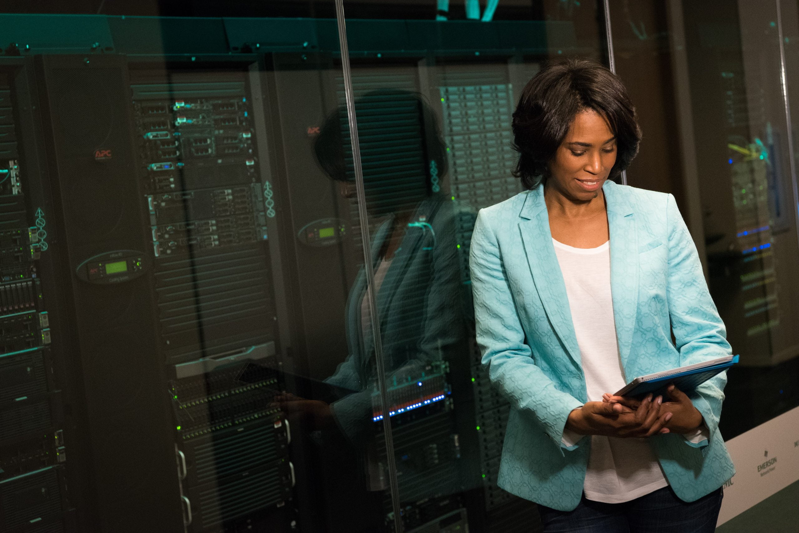 lady in blue jacket behind servers